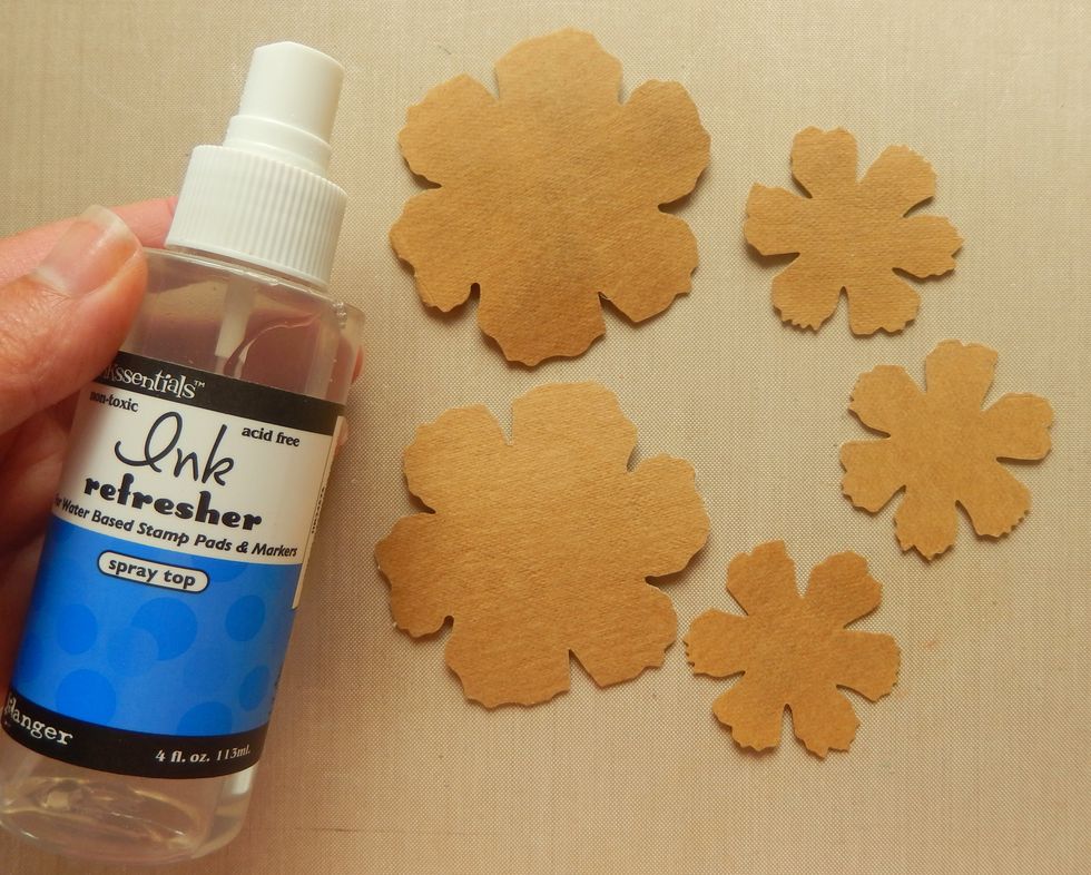 Turn all the flowers onto the revers side and mist with Ink Refresher. Work all the liquid into the substrate until it has been fully absorbed. The flowers will now be supple.