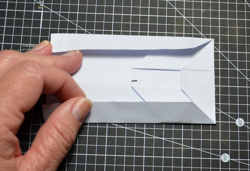 Turn and fold the other side.