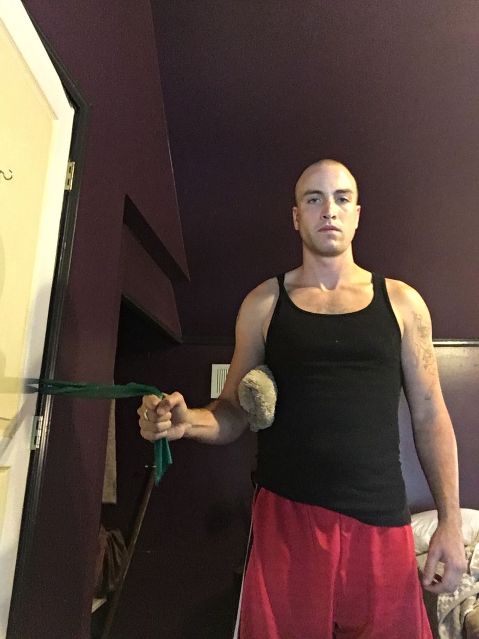 Turn around and face the opposite direction. This focuses on internal rotation. Depending on your injury, it may be easier or more difficult than the other exercises.