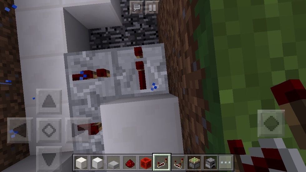 Turn around once again and place down a redstone repeater.
