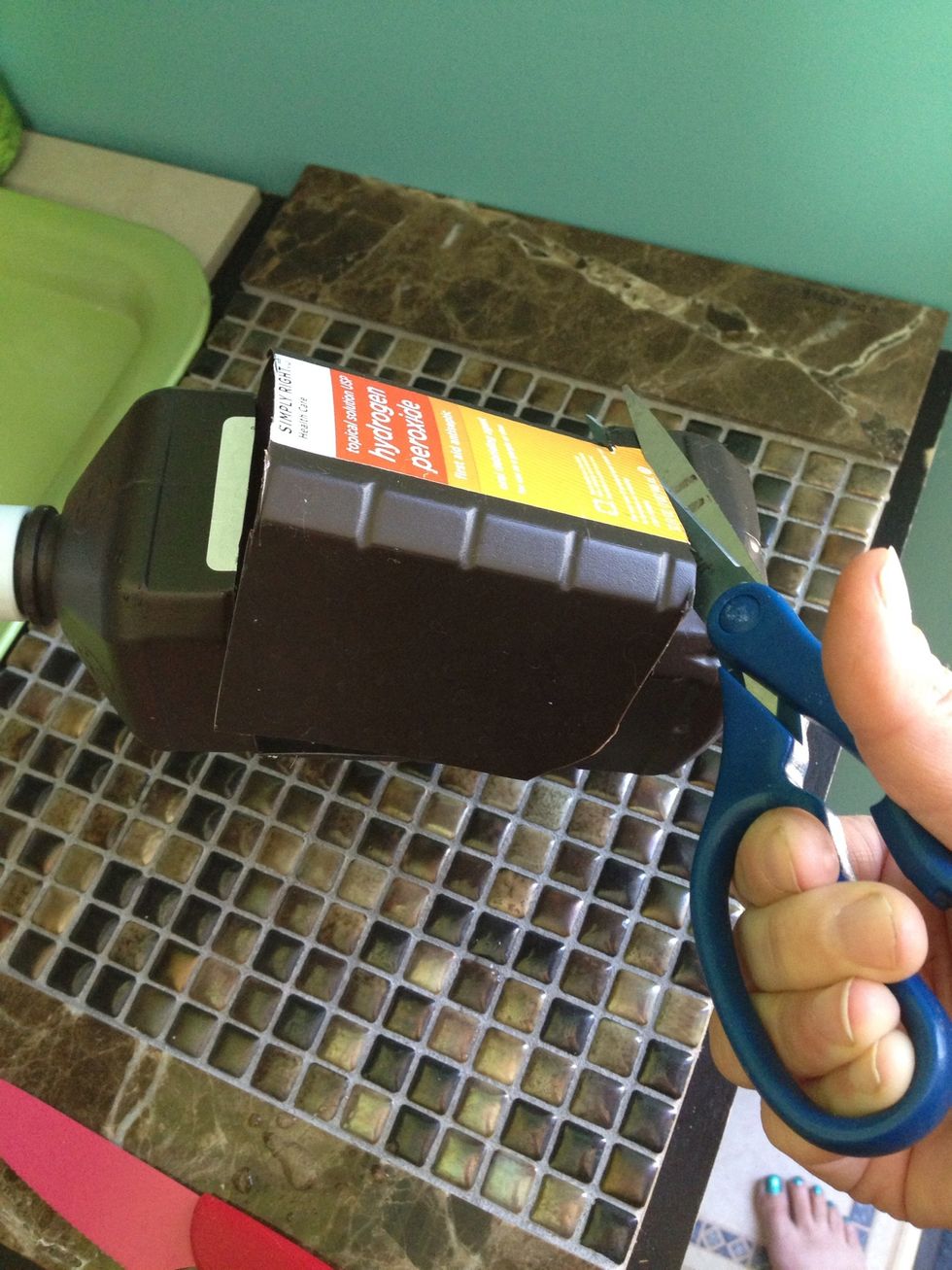 Turn bottle and cut across one final time then cut down and across making a 3sided window.