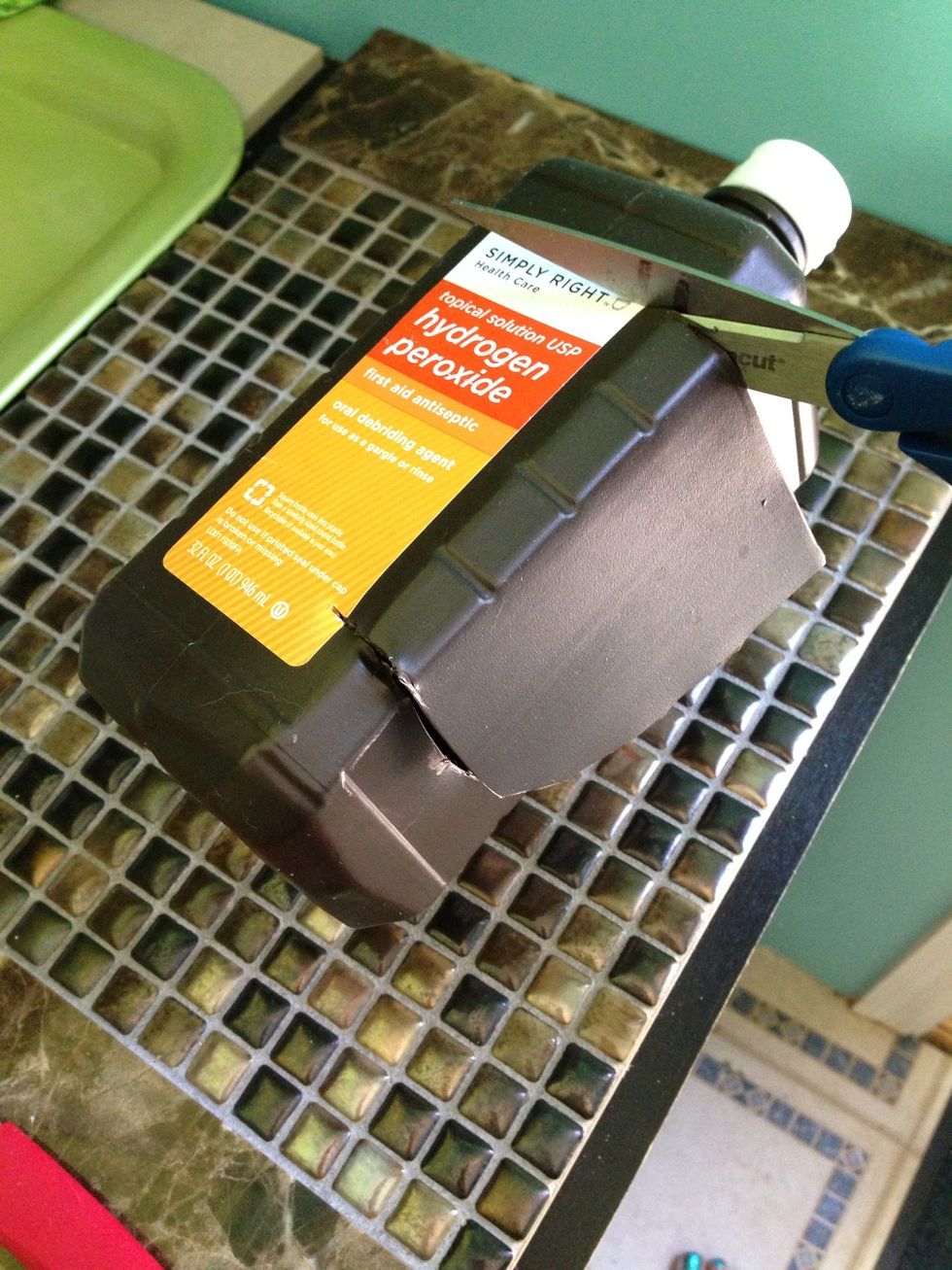 Turn bottle and cut straight across the next side.