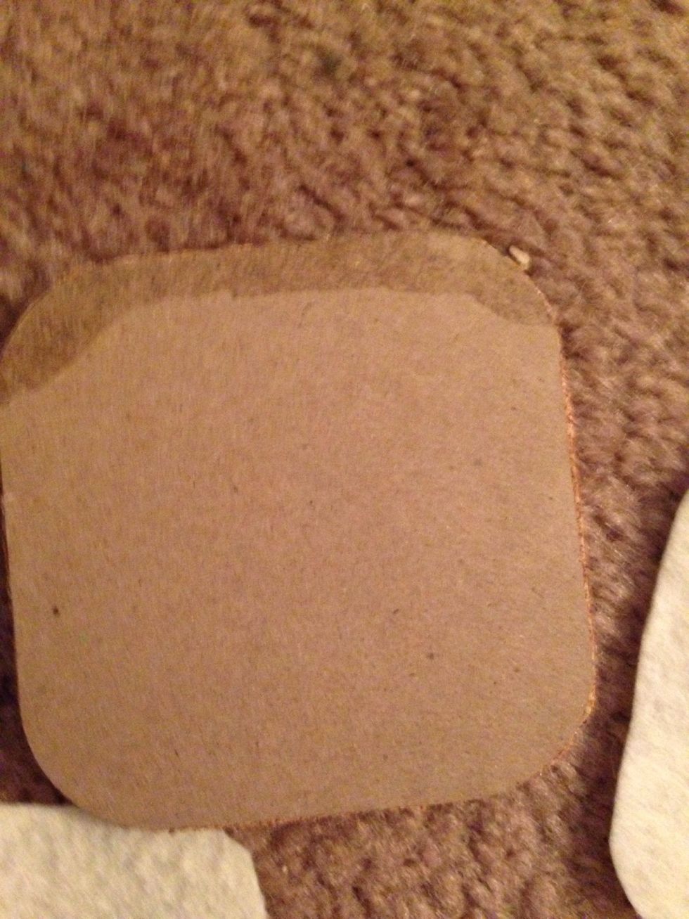 Turn coaster over and place superglue (or hot glue or tacky glue) around edges. I found that superglue holds the felt the best without making it bumpy.