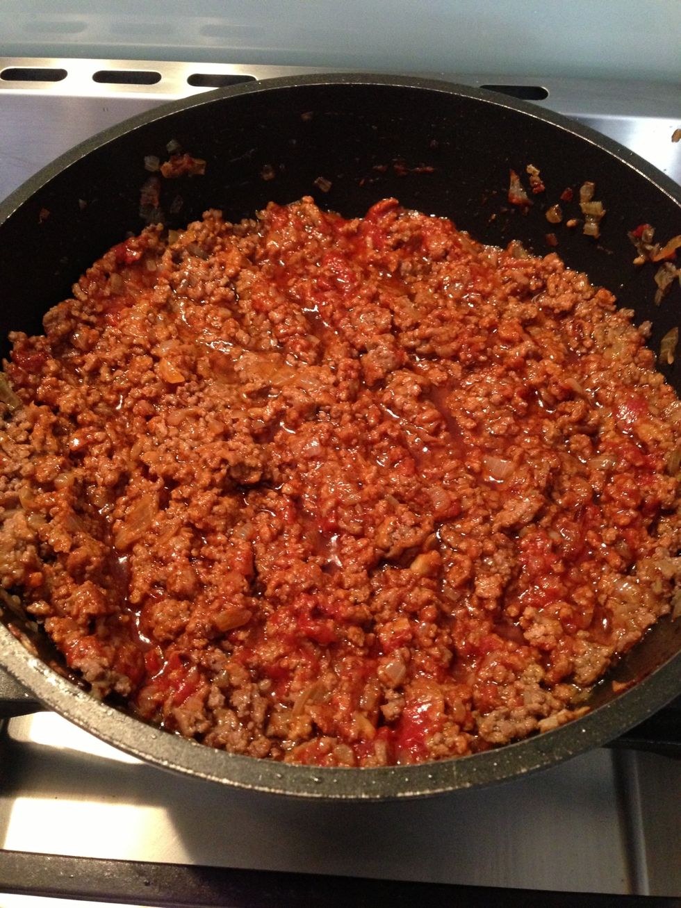 Turn down heat to medium (on small burner) low on (larger burner) Add tomato paste to beef / onion mix Mix through and cook for 2-3 minutes