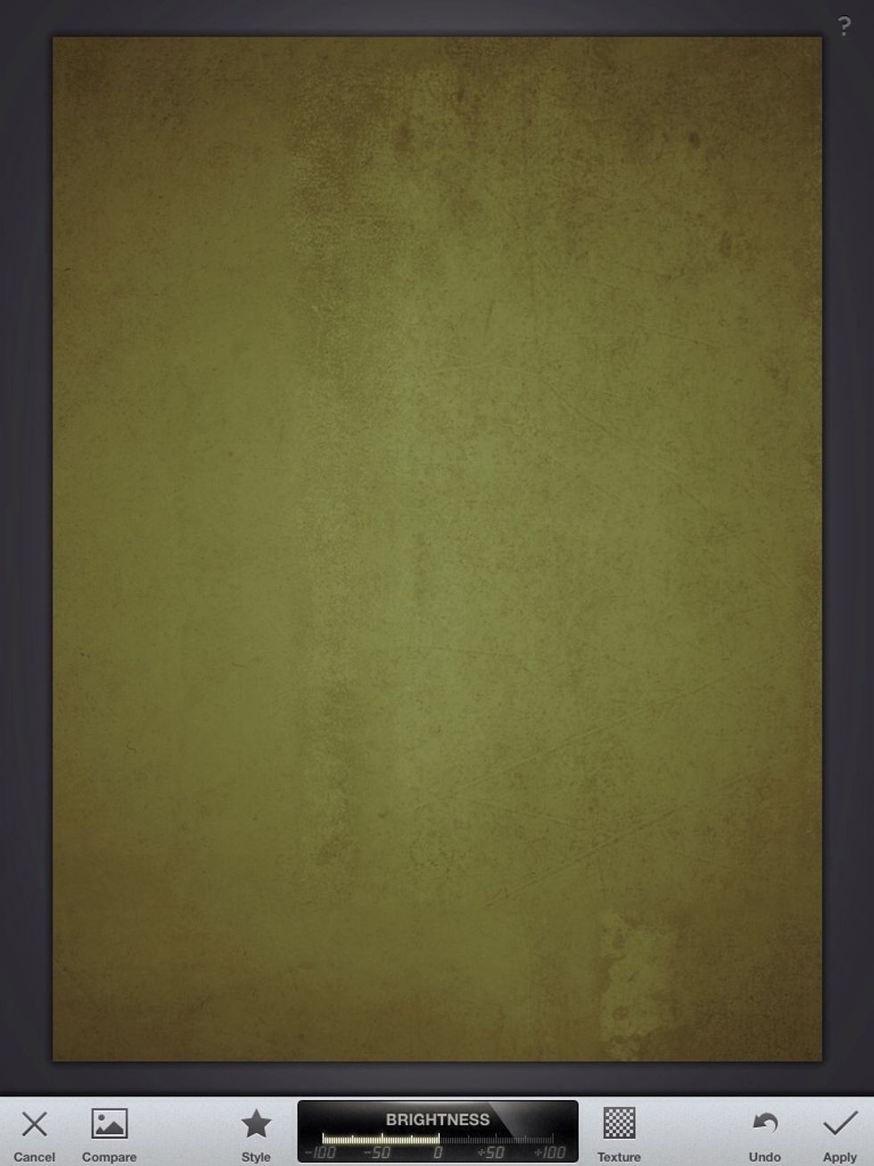 Turn down the brightness by dragging a finger to the left on top of the image. Tap "Apply"