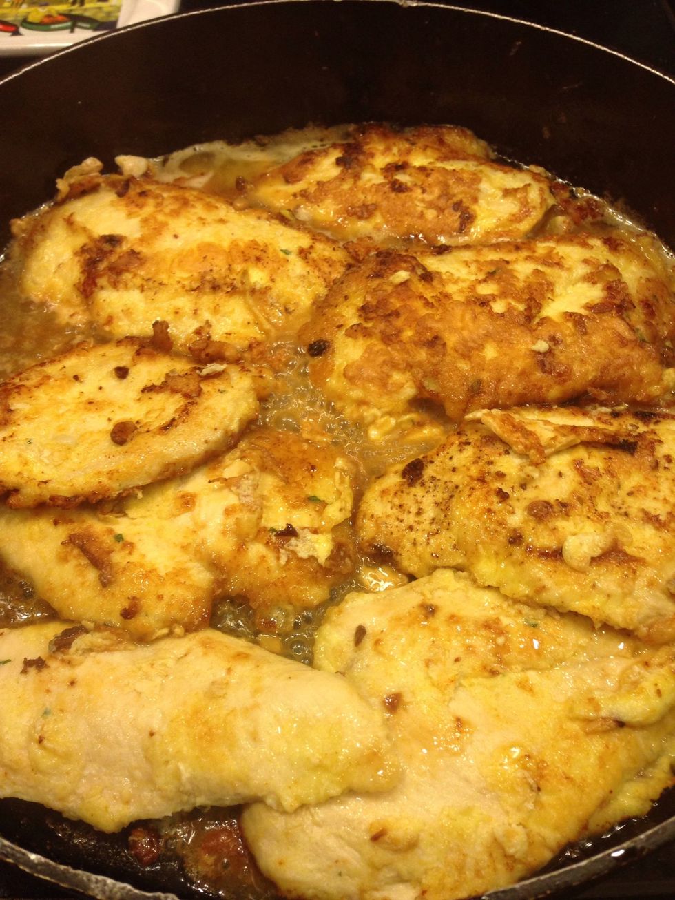 Turn heat down to low and put chicken back into the pan