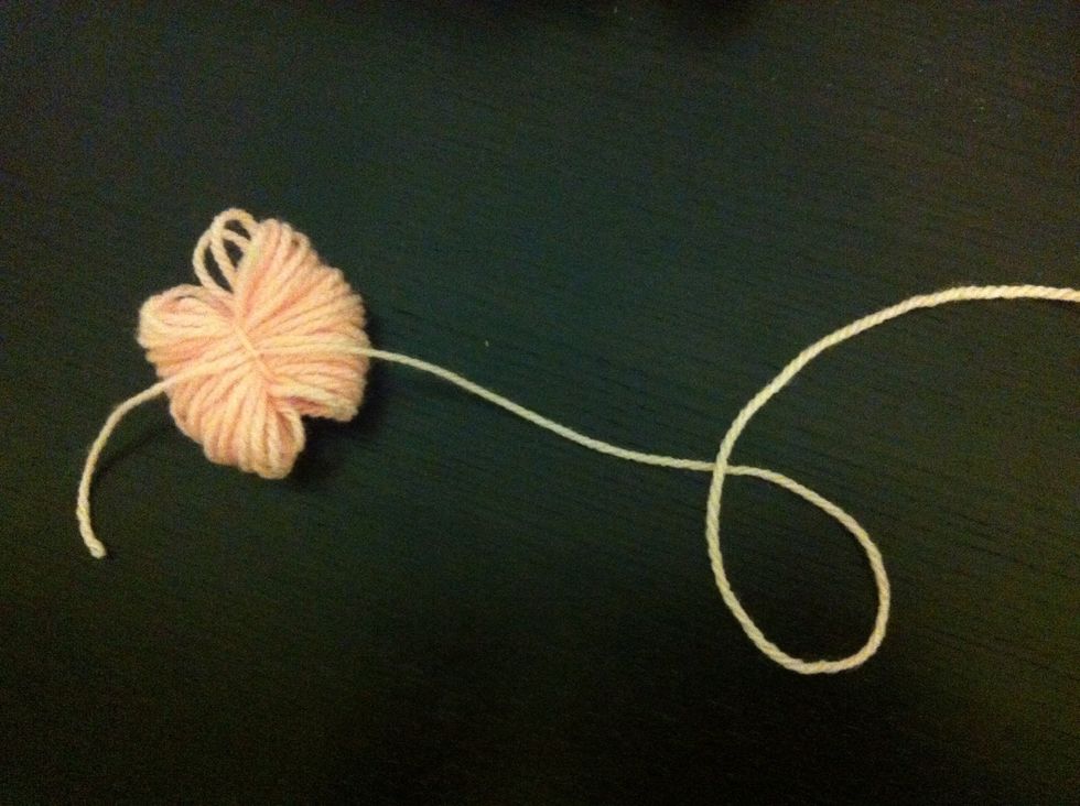 Turn it around, look all over it, make sure it's in the middle, and tie it very tightly with a double knot