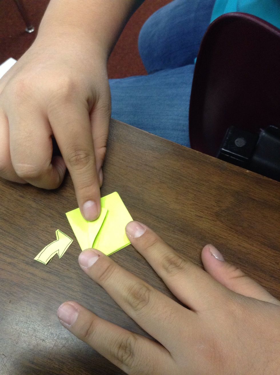Turn it diagonal so the open part is at the bottom and the closed part is at the top. Fold the left corner near the center and make a triangle shape.