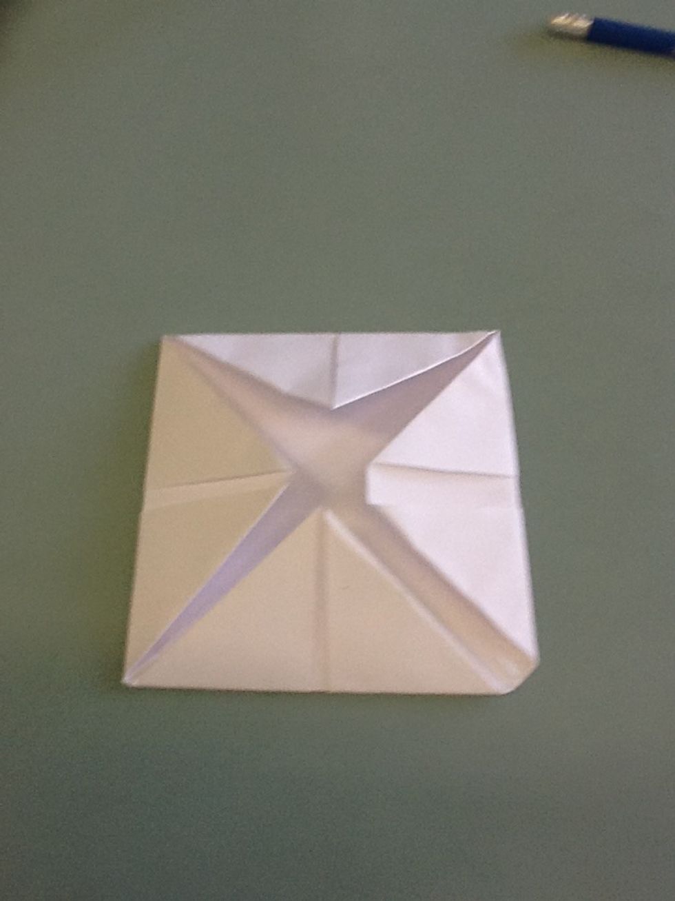 Turn it over and fold the corners in