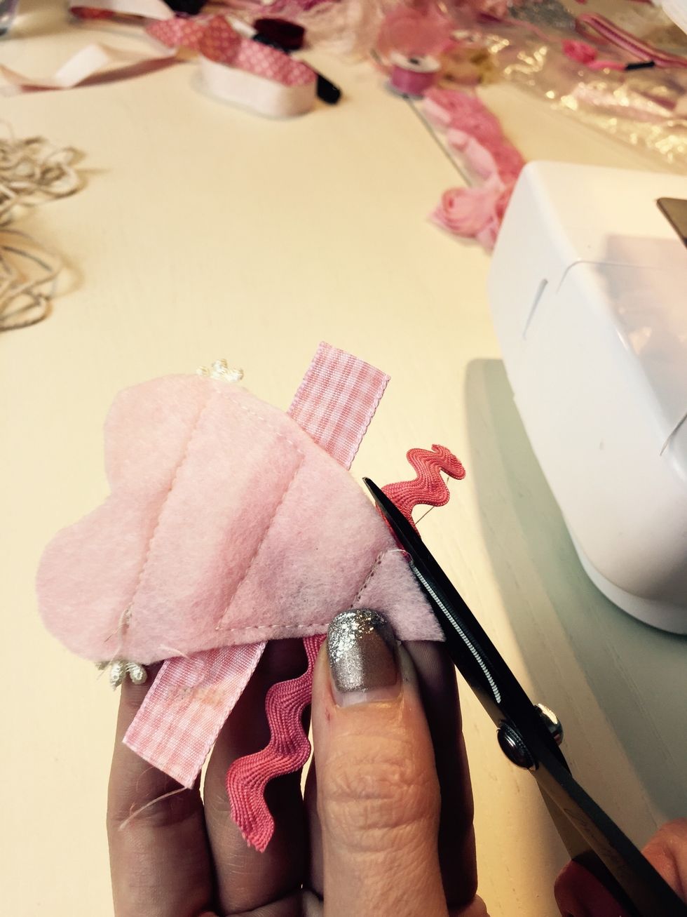 Turn it over, and using some scissors trim the ribbon to your hearts.