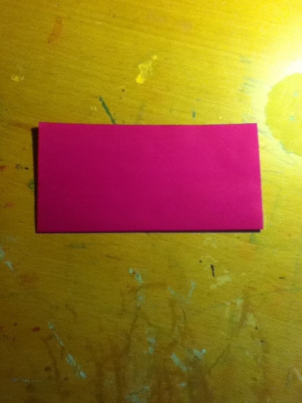 Turn it so its white side up and fold in half