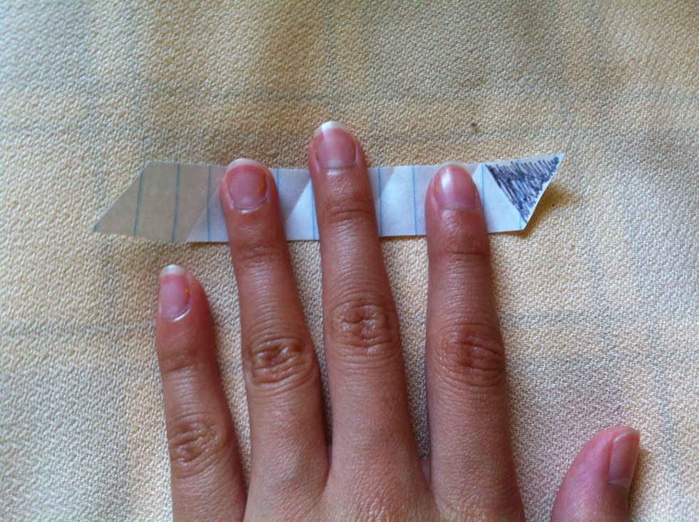 Turn it so that the triangle ends are both pointing down (ignoring the black one )