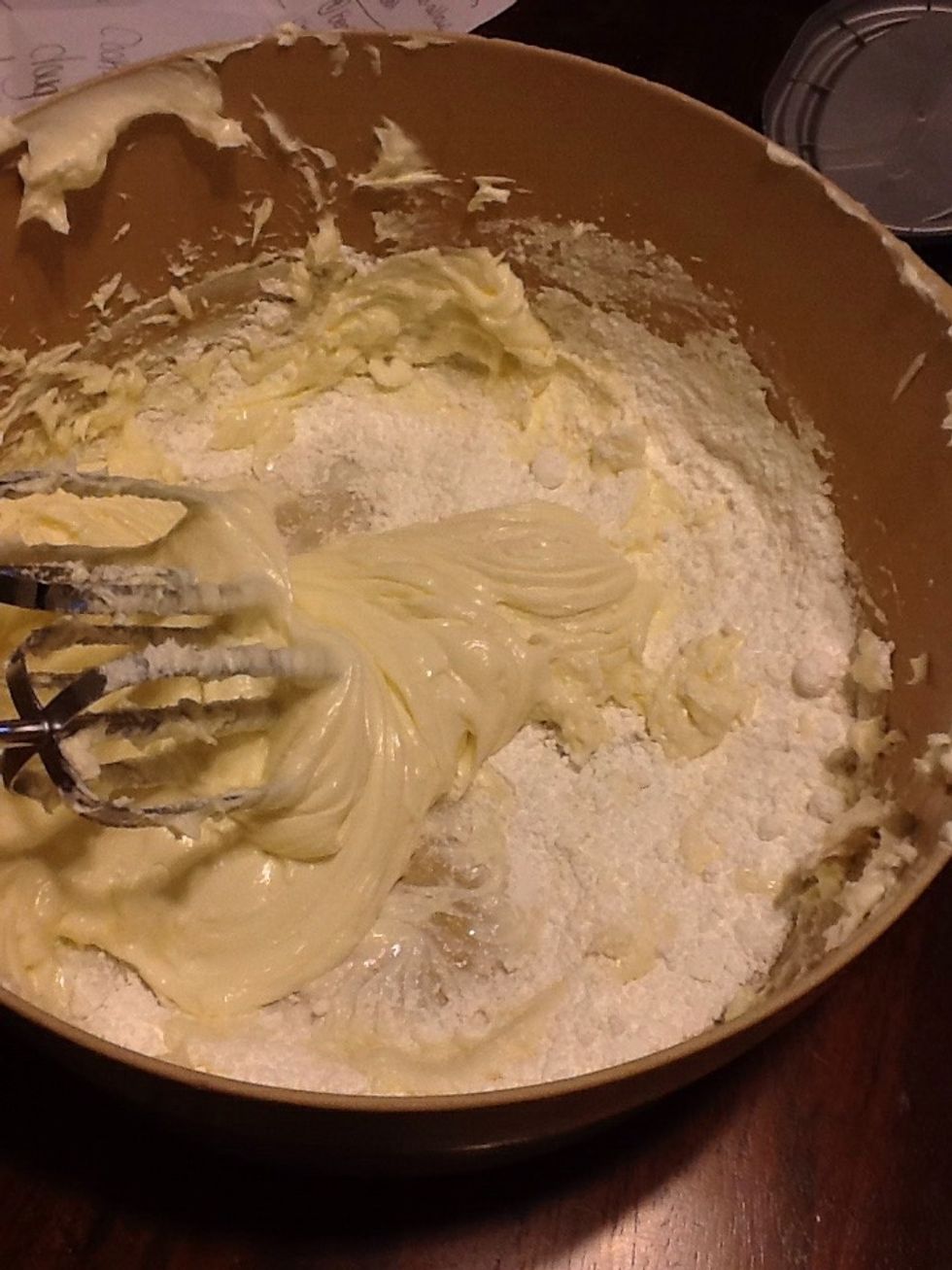 Turn mixer to low and add powdered sugar. When it's combined mix on medium until fluffy.