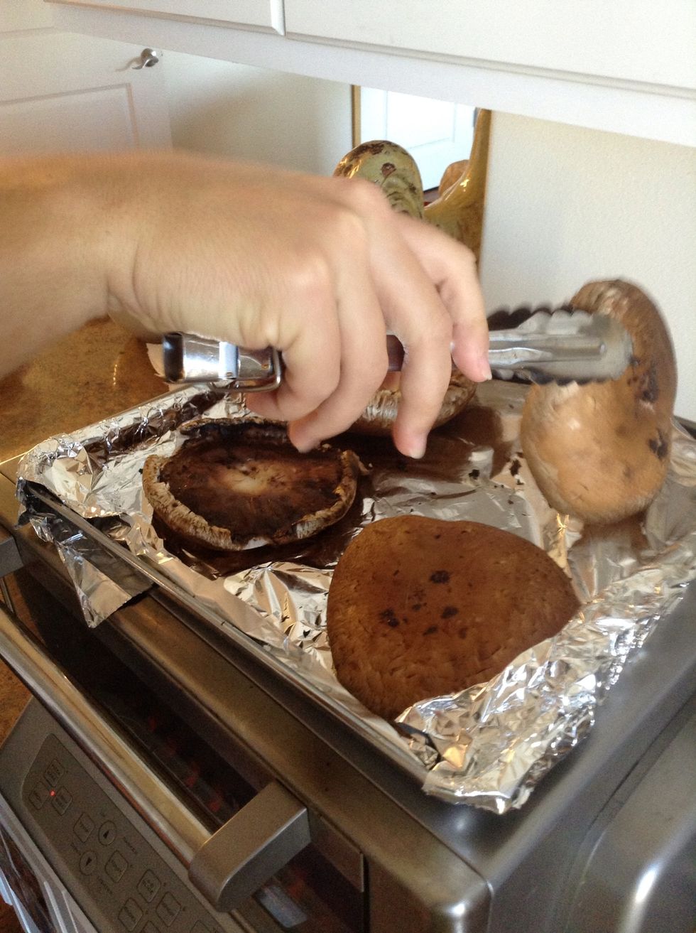Turn mushrooms over using tongs