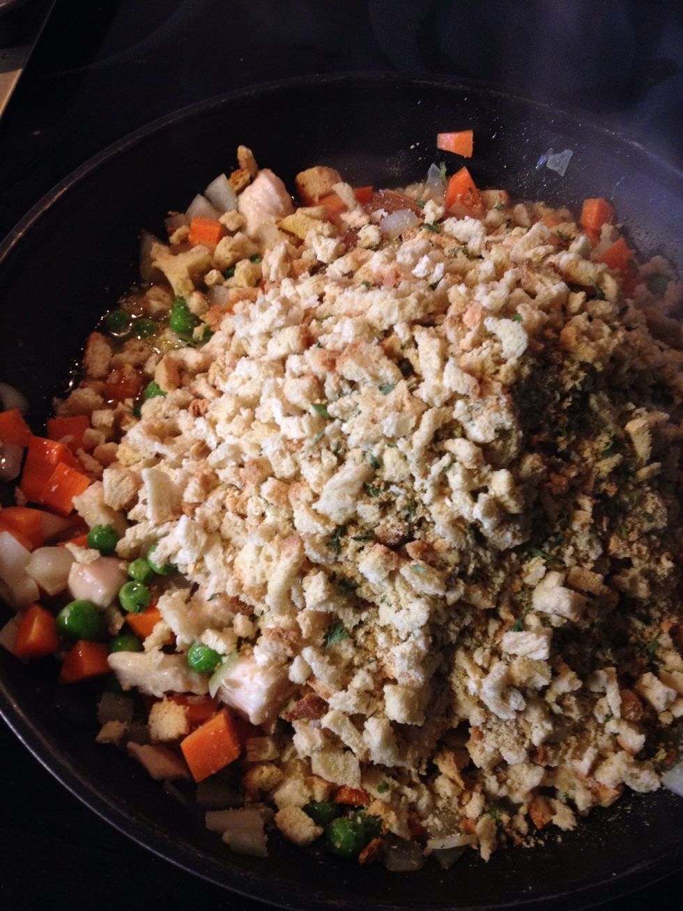 Turn off heat, add chicken stock and stuffings