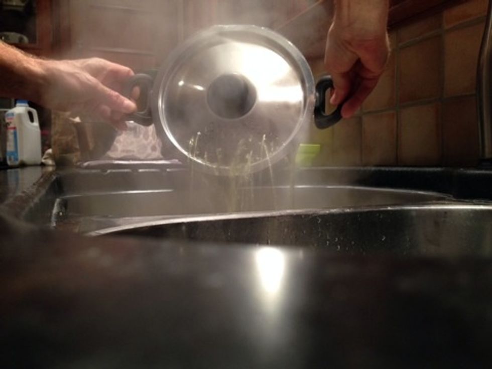 Turn off stove. Pour out water. No need to get all the water. Flexible.