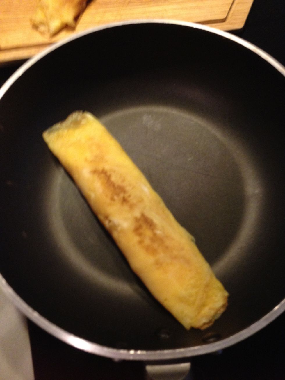Turn off the heat. Leave the egg roll on the pan for a while to cook it through. ( the inside should be cooked by now don't worry) this gives the tamago nice brownish colour.
