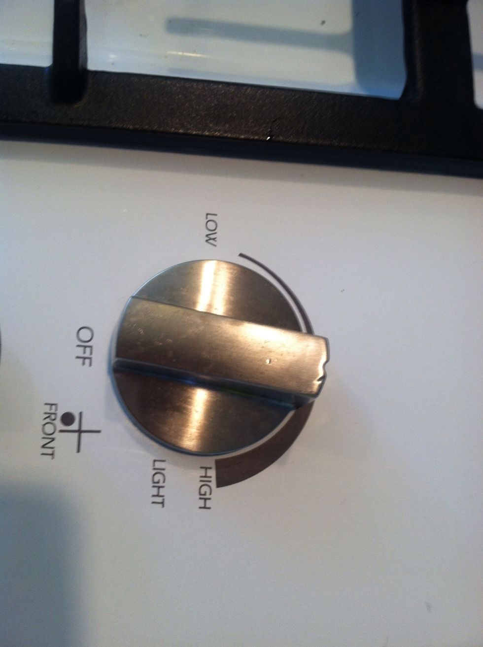 Turn on heat to medium and shake pan to coat all the popcorn until the oil melts and popcorn starts to pop