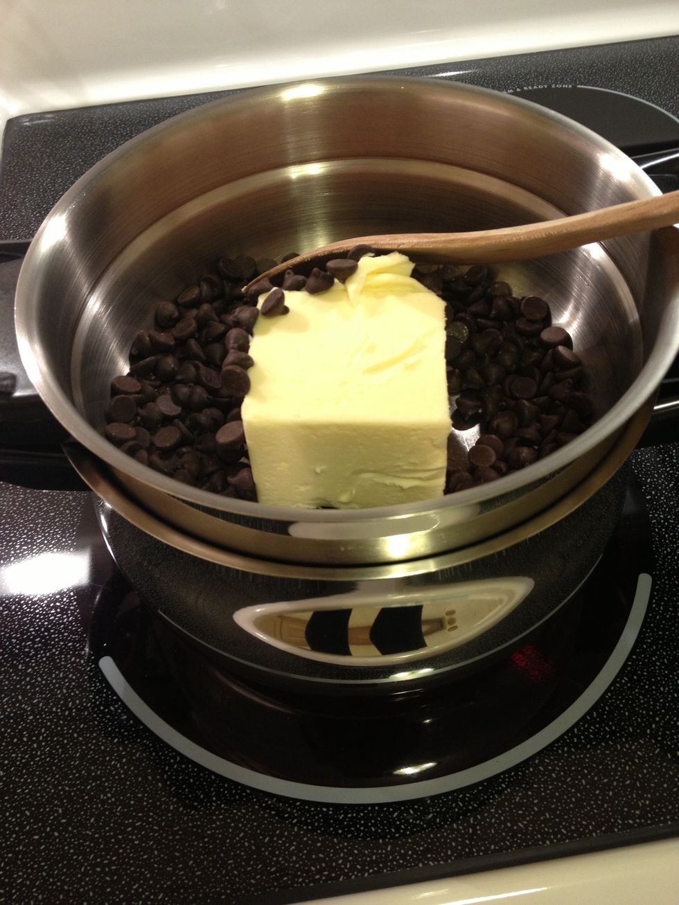 Turn on the stove top to melt the butter and the chocolate using a double boiler.