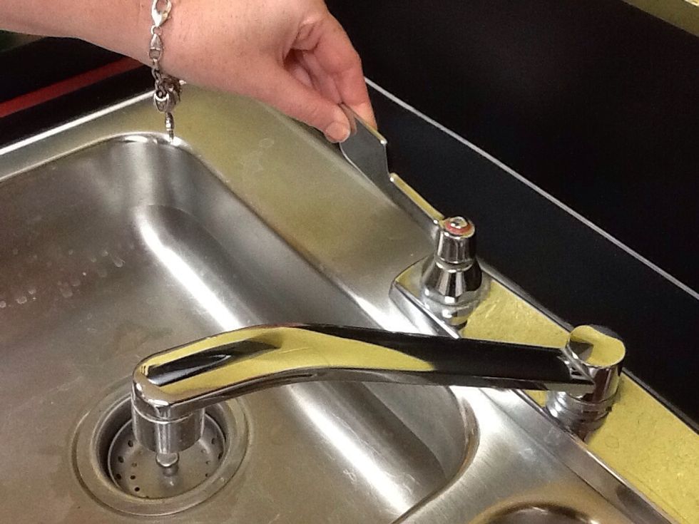 Turn on warm water and begin filling the sink til 2/3rds full.