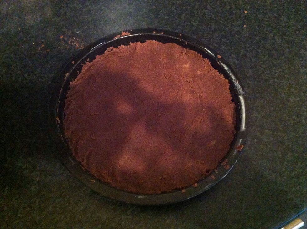 Turn out into the greased tin and press to fit