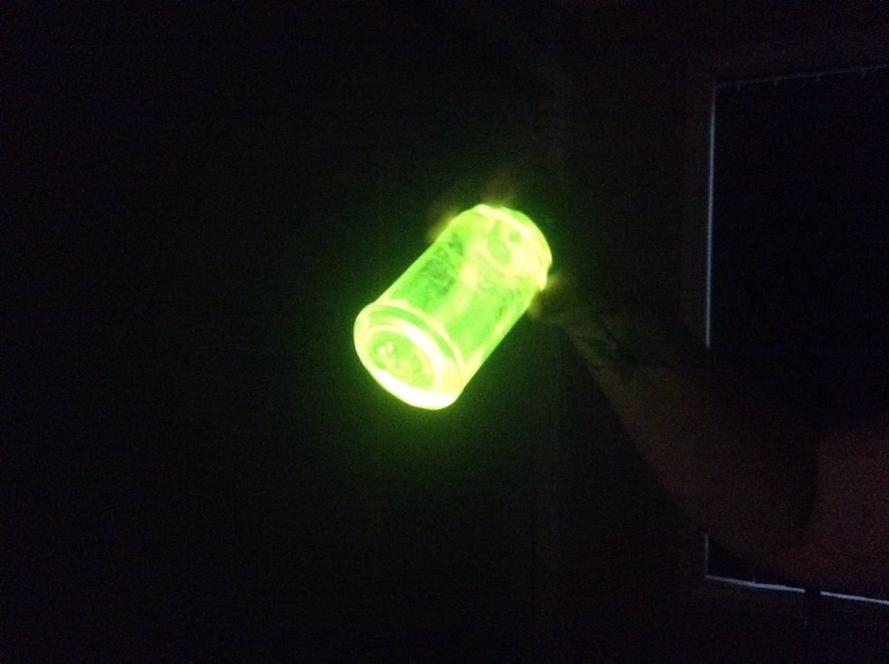 Turn out the lights and see it glow. Now you have a glow in the dark jar. Note: the colour depends on what colour glow stick you used - here I used orange/yellow.