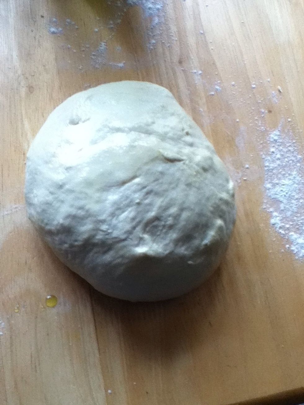 Turn out the sticky dough and fold into a round. I like to put a layer of olive oil around it.