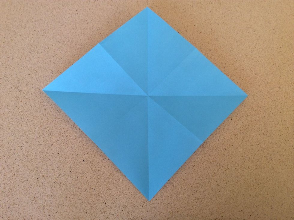 Turn over and fold in half diagonally like so.