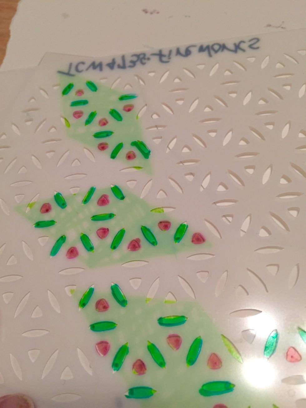 turn over diamond pieces and add accents to them with Fireworks stencil and Aqua and Hot Pink Makers.