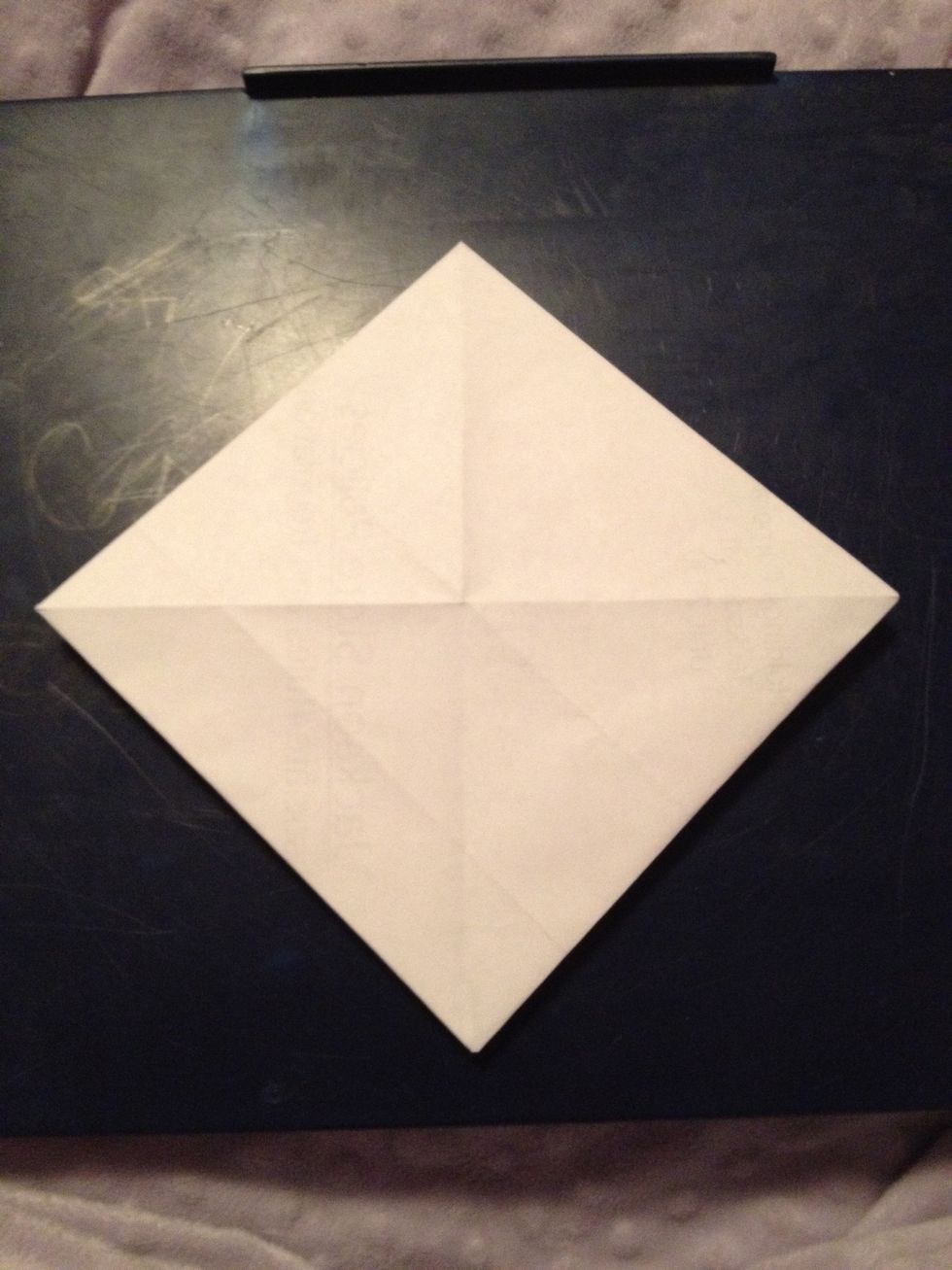 Turn over so that open flaps are facing down.