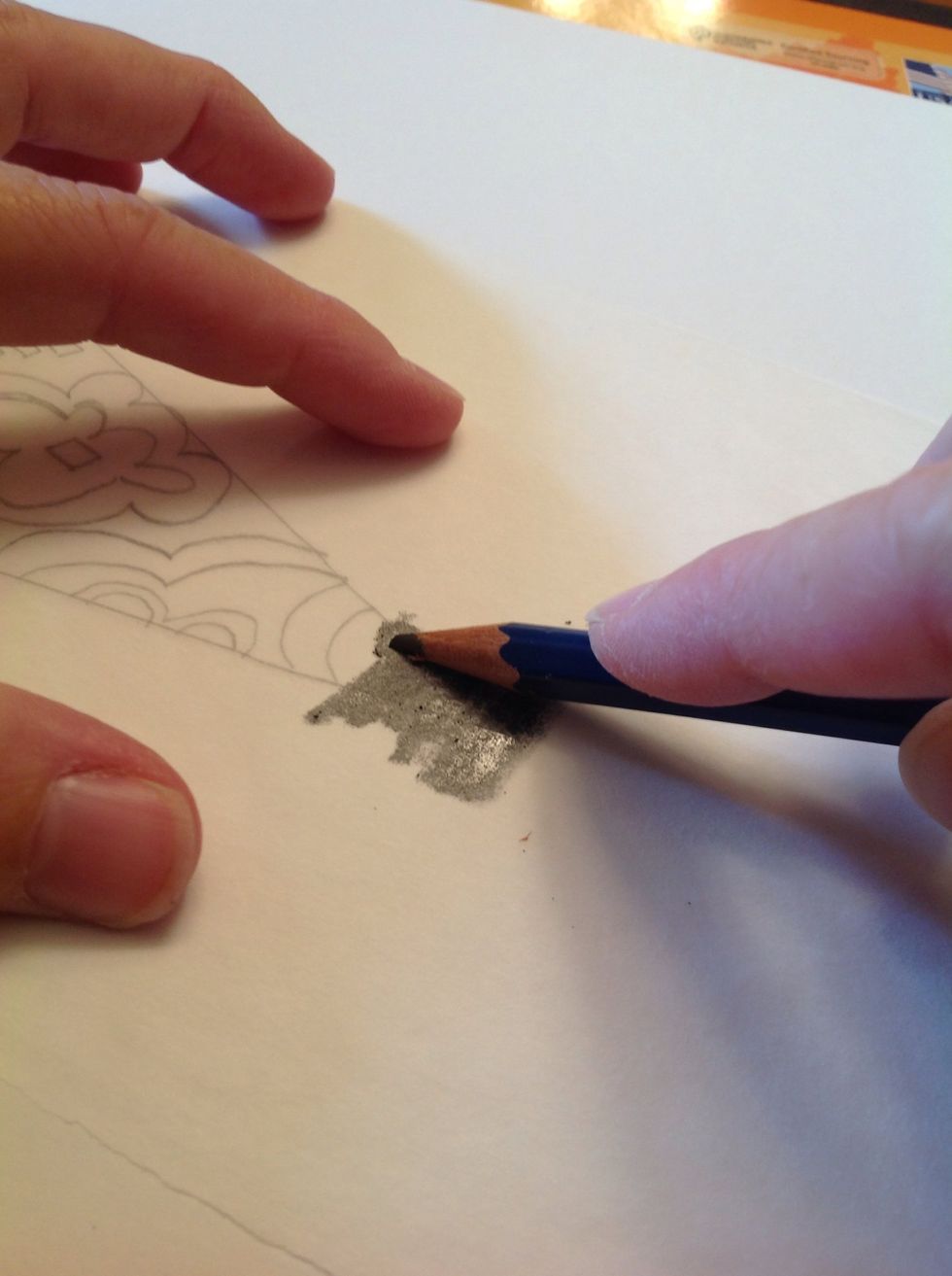 TURN OVER the tracing paper and get a soft lead pencil and completely cover the back side of the tracing paper where there is drawing.