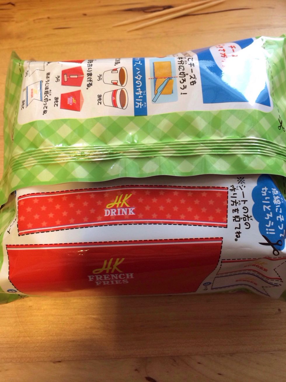 Turn Package over and find the guidelines for cutting out your accessories-- You will need to cut out and assemble Fry Bag, Cup Label, Burger Picks/Flag, Cheese Rolling Guide, and Placemat