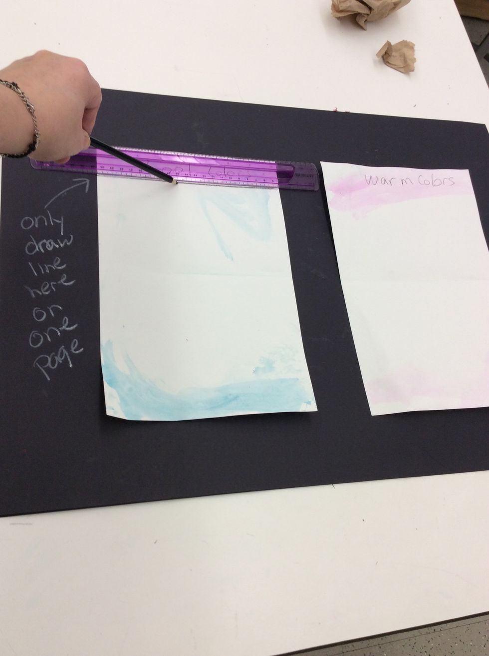 Turn pages over. Write "warm colors" at top of warm color page. Write "cool color" at top of cool color page. Align a ruler at top of only one page. Draw a horizontal line against bottom of ruler.
