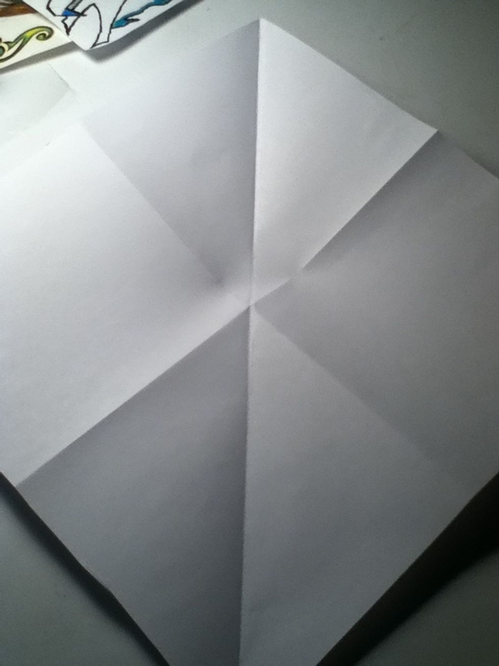 Turn paper to look like a diamond and fold across