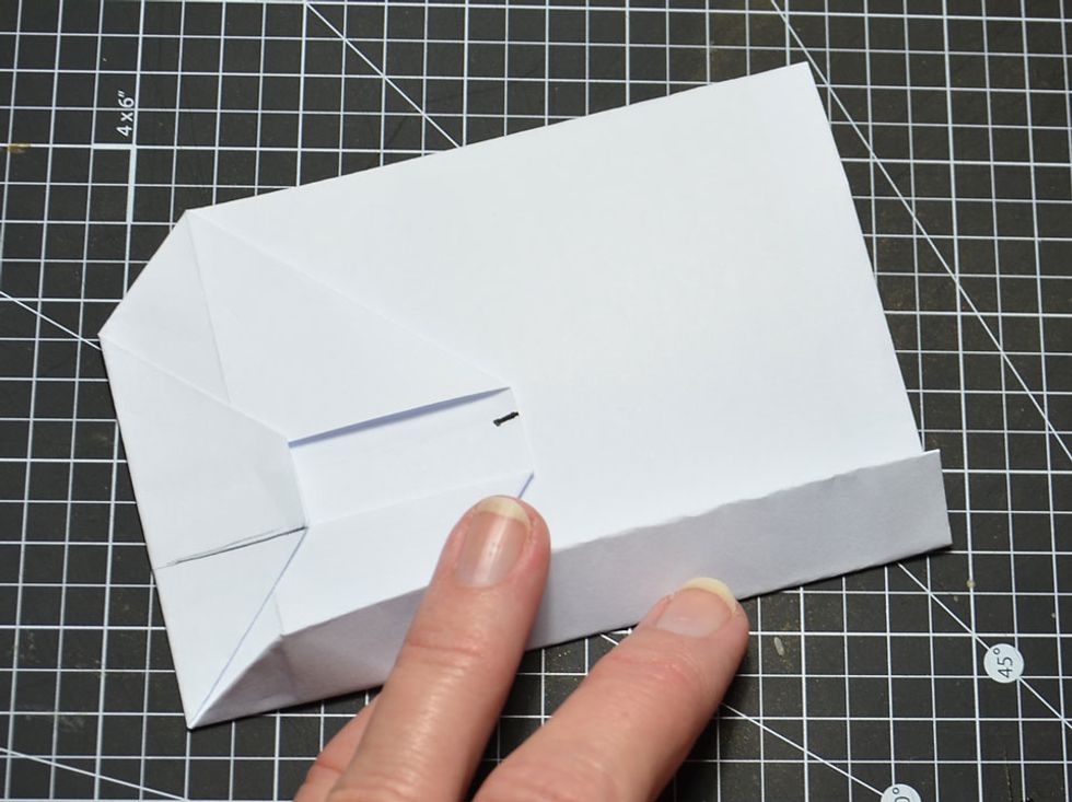 Turn sideways and fold as shown.