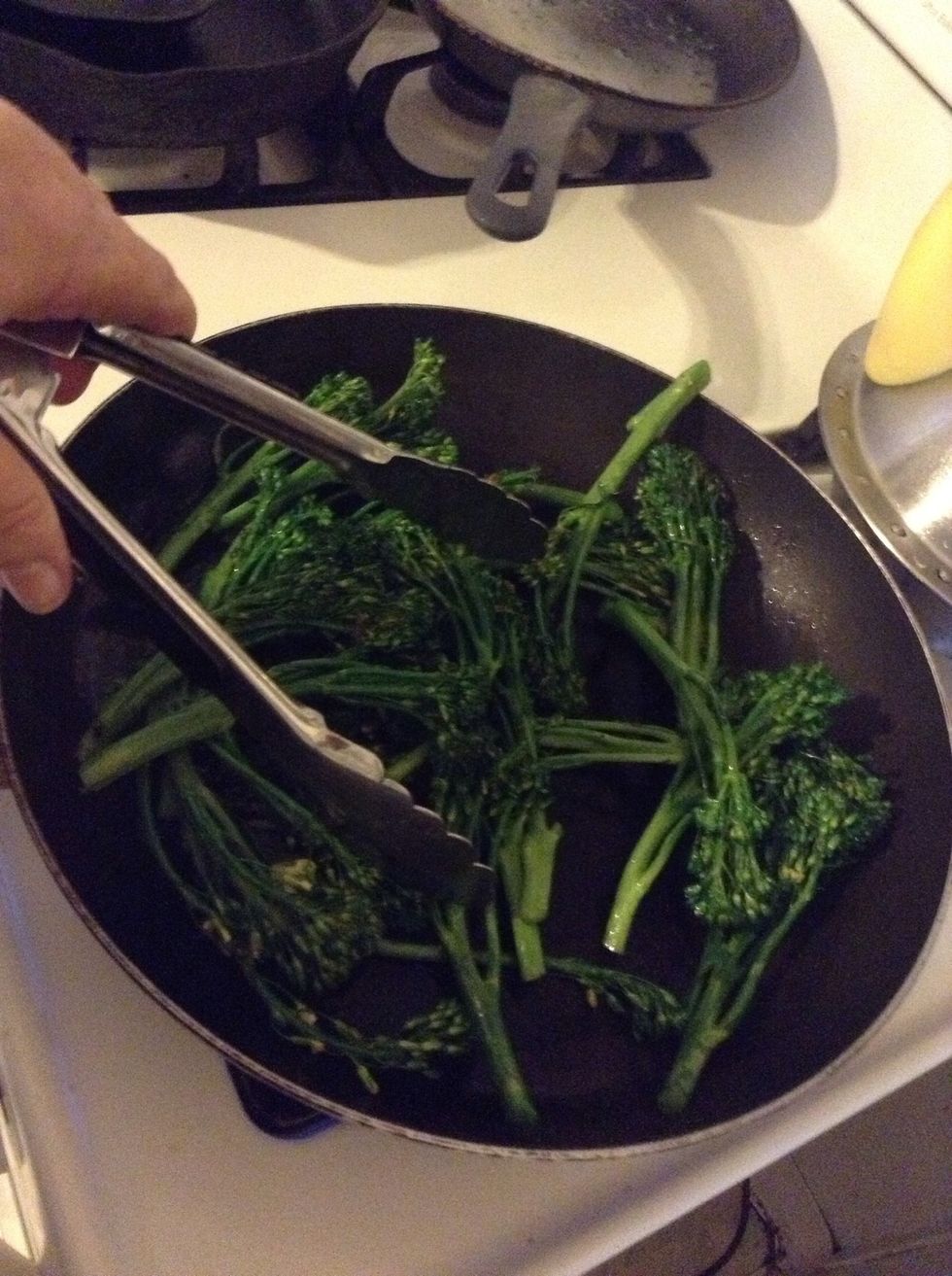 Turn so they are evenly covered with the olive oil. Keep turning as you saut\u00e9 the baby broccoli.