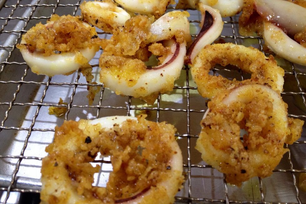 Turn squid occasionally to cook evenly; it will only take about 1 1/2 minutes or so until they are crisp and golden. Fry remaining squid and drain.