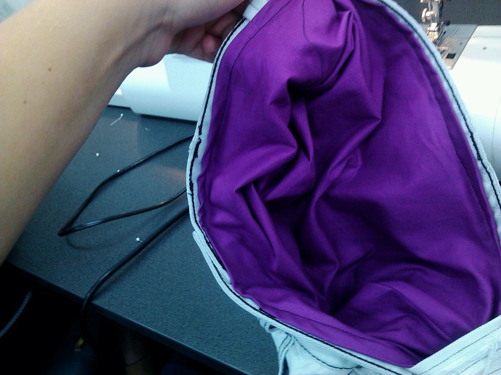 Turn the bag inside out and sew on the lining all round the bag