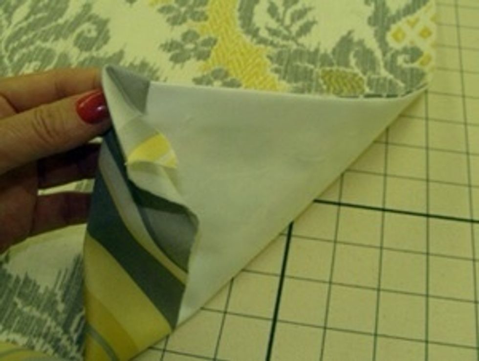 Turn the banding to the back, wrapping over the top edge. Press with an iron along the top to create a 3/4'' banding.