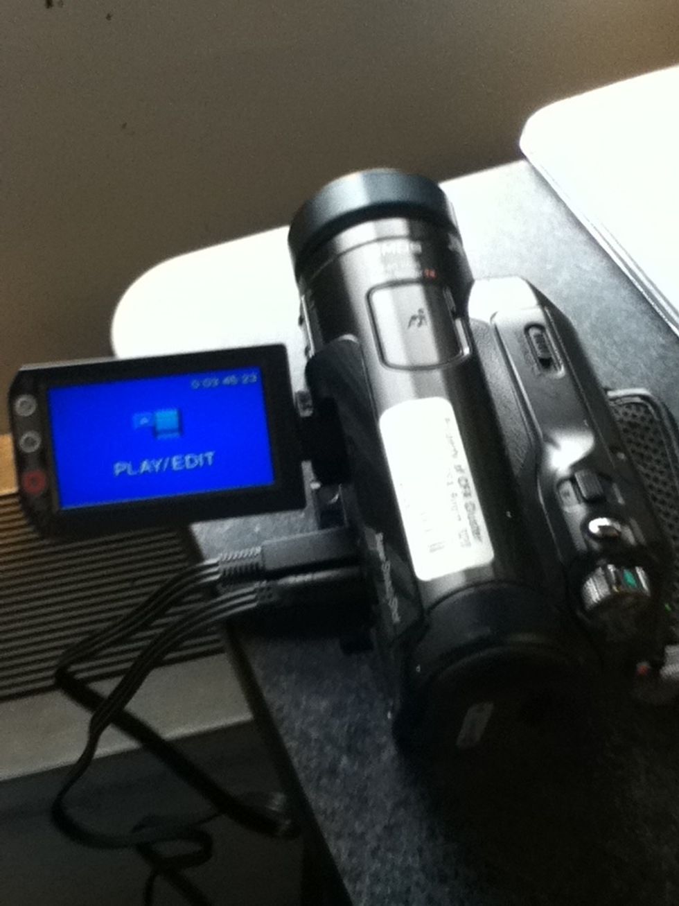 Turn the camera on. Use the mode knob to change into PLAY/EDIT mode.