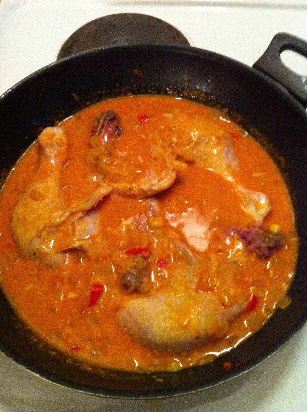 Turn the chicken and bury it in the sauce. Put on the lid and let it cook on medium heat for 30-40 min.