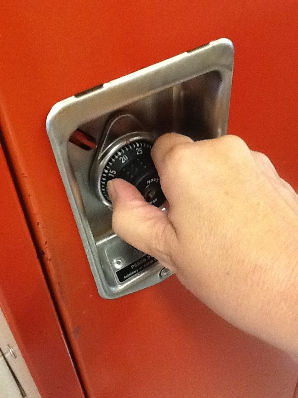 Turn the  dial to the right three (3) complete turns.