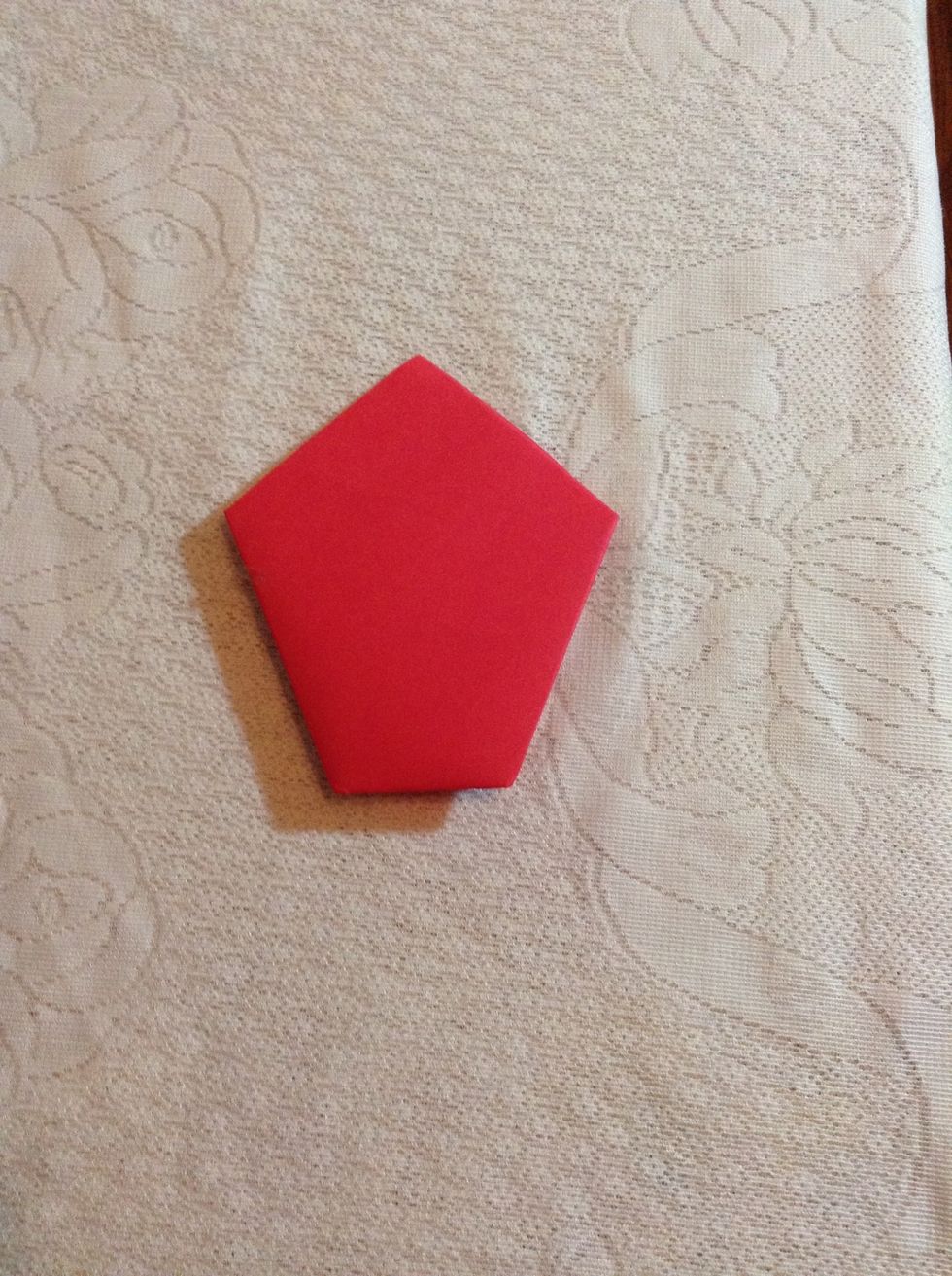 Turn the entire folded paper over and lay it face down.