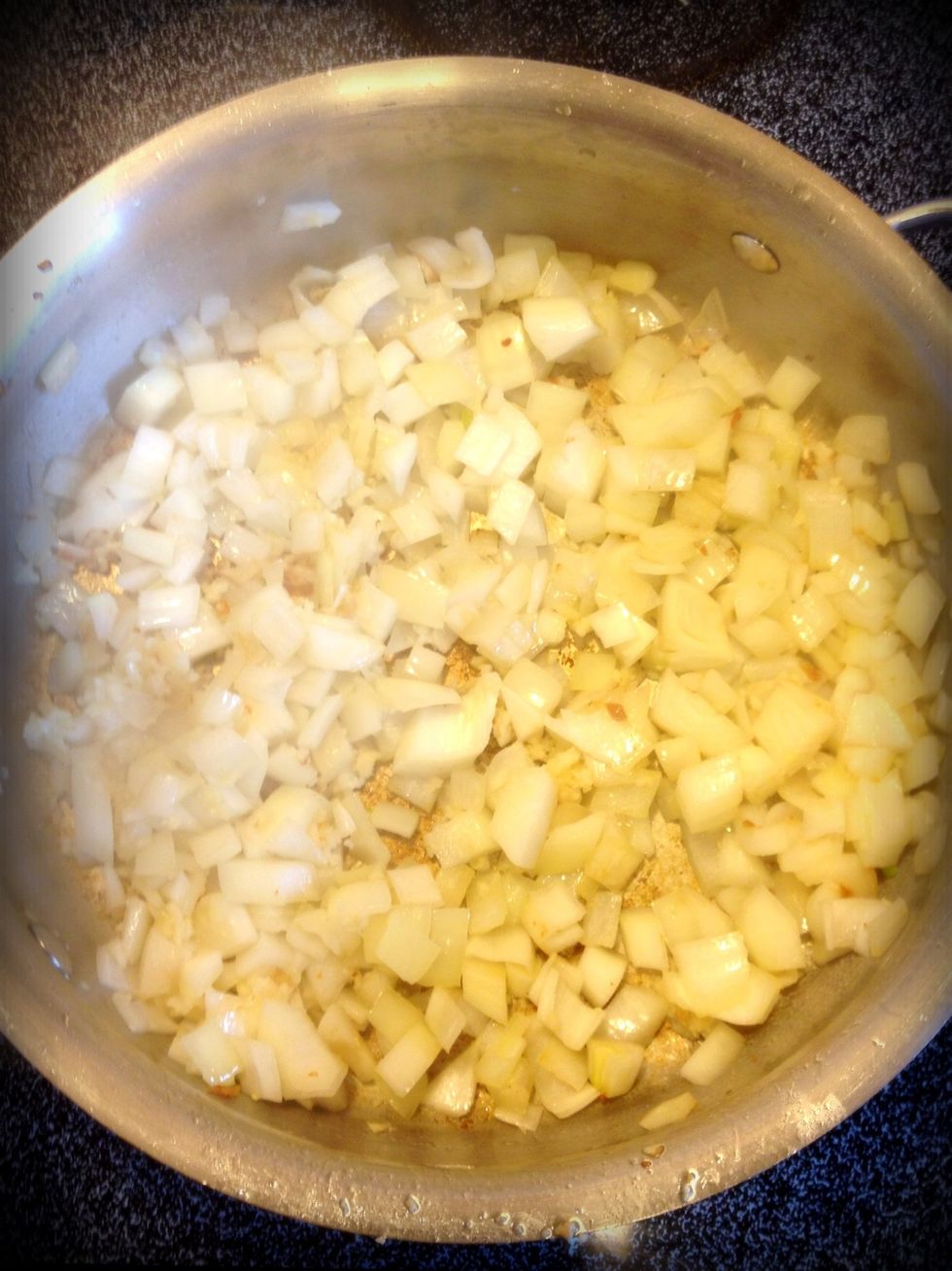 Turn the heat down to medium. Add a little more butter and cook the onions and garlic until light brown.