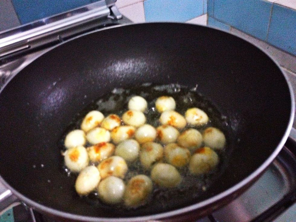 Turn the heat medium to high. Add in 4 tbsp of canola oil and fry the eggs for 1-2 mnts until you get slightly brownie skin egg. Set aside when done