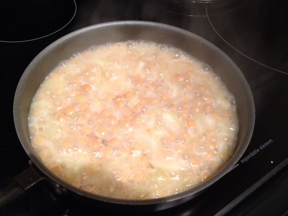 Turn the heat up to high, and cook for 5 minutes or until just about all the liquid as evaporated out. The chickpeas should turn slightly brown.