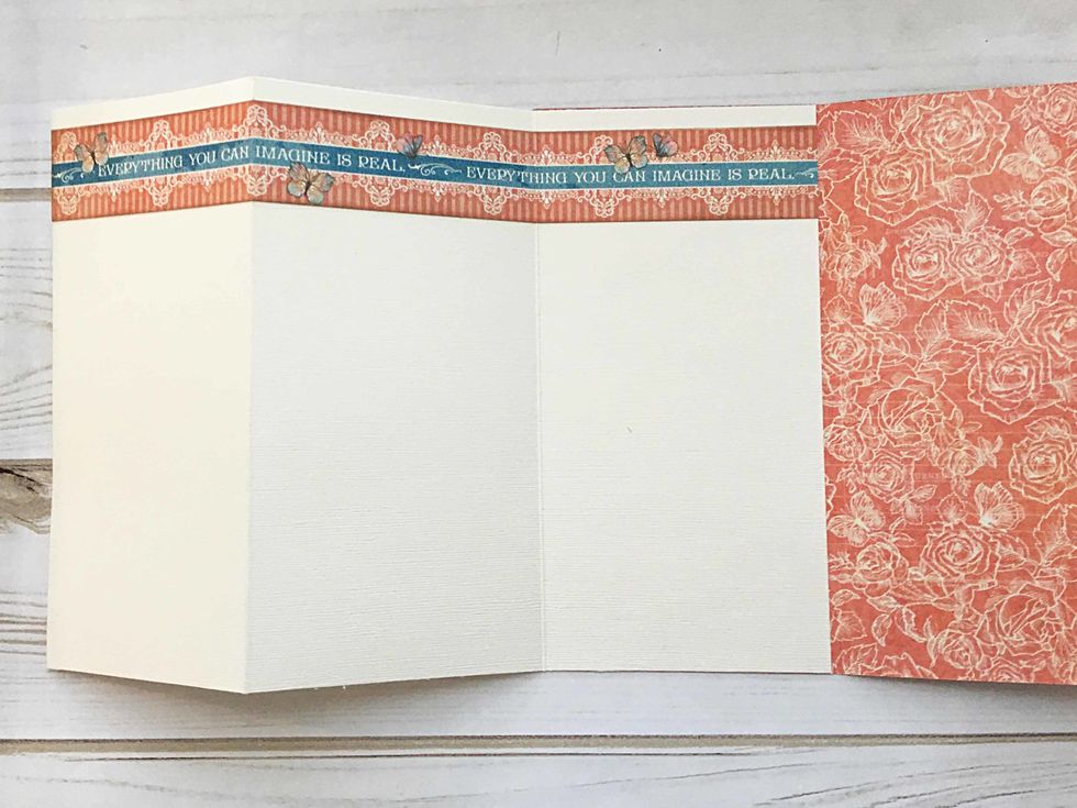 Turn the ivory cardstock over so that  you are looking at the backside. Locate the strip shown at the top, score at 4" and 8 " and glue near the top of the ivory cardstock.