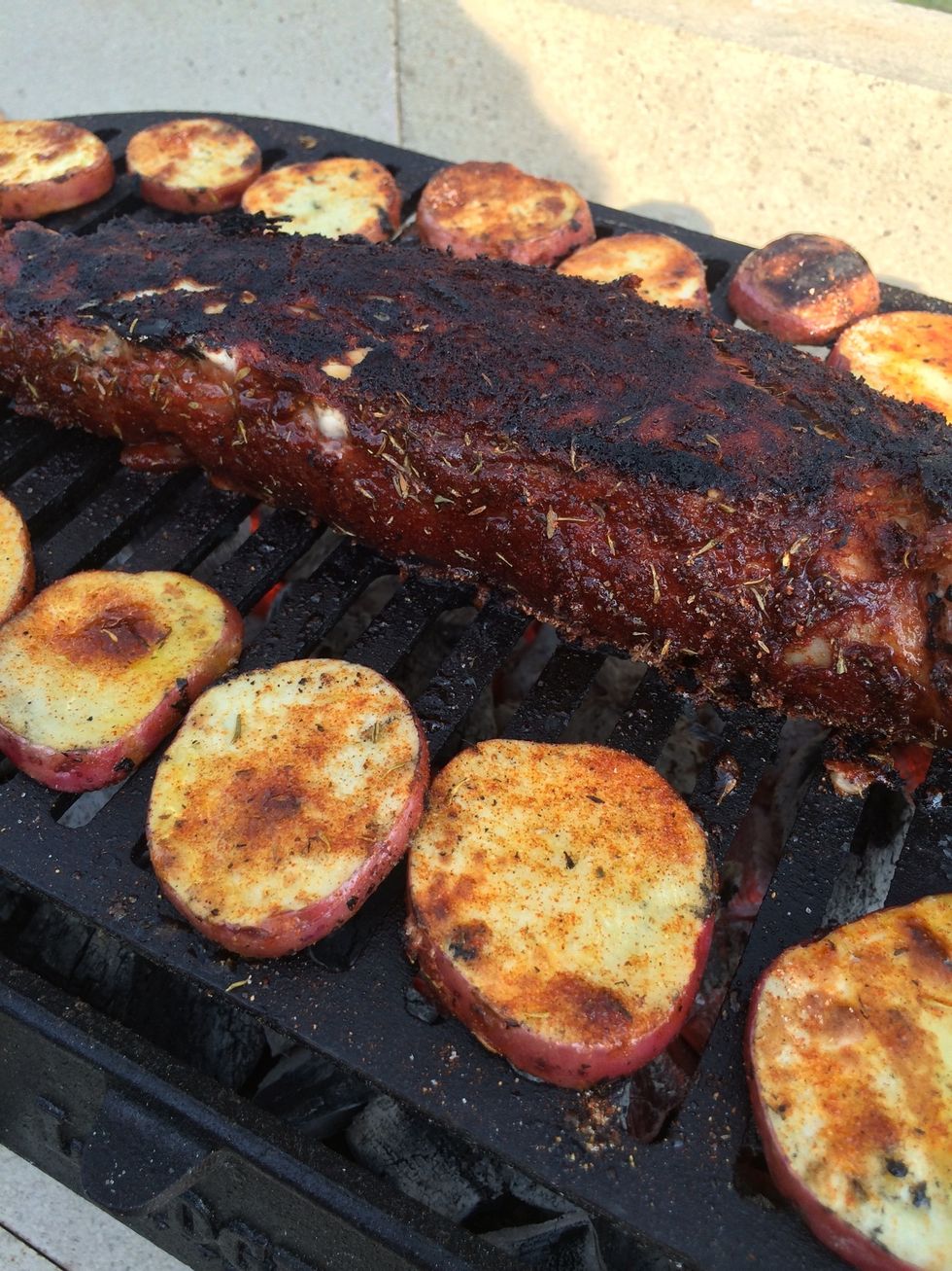 Turn the loin after 5 minutes. Grill the loin on all "4" sides for five minutes each (20 minutes). Turn potatoes. In this guide, the potatoes were done before the pork.