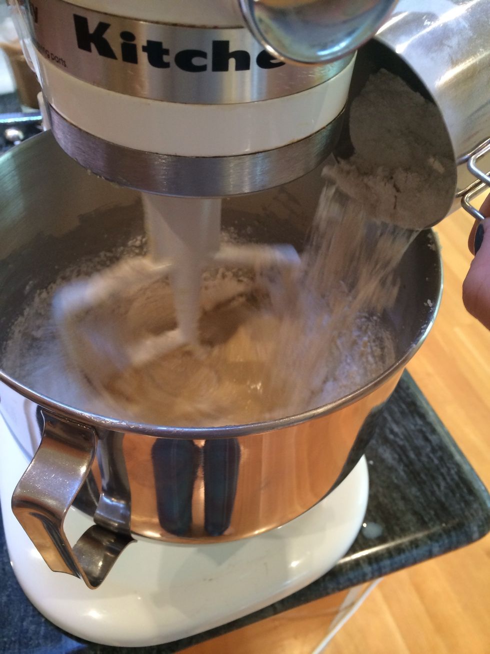 Turn the mixer to low, and then gradually add the flour.