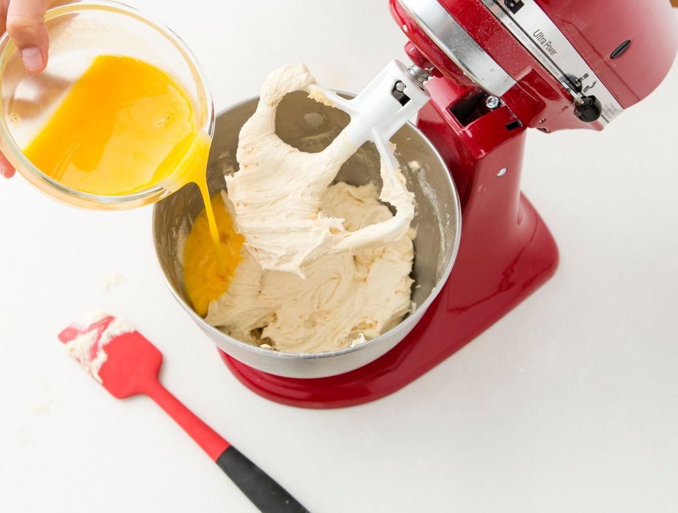 Turn the mixer to medium and add in your eggs, whisked, in two batches. Be sure not to over mix!
